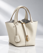 Women's off-white leather bag front view — everyday — Mara Leather Bucket Bag — Oscar Blackwood