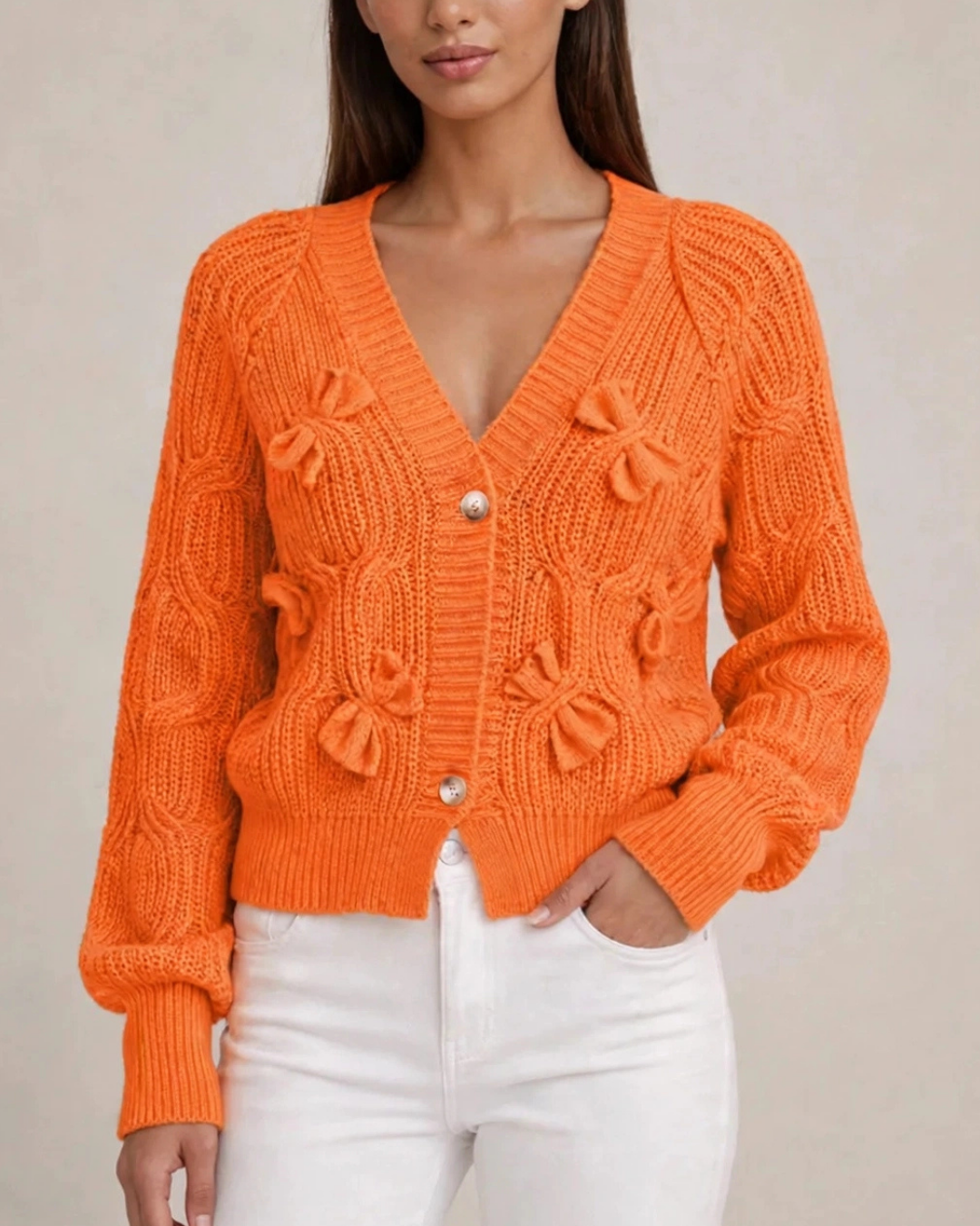 Women's orange ribbed cardigan close-up — cozy — Romina Bow Knit Cardigan — Oscar Blackwood