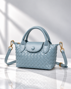 Women's light blue woven handbag back view — everyday — Marguerite Woven Crossbody Handbag — Oscar Blackwood