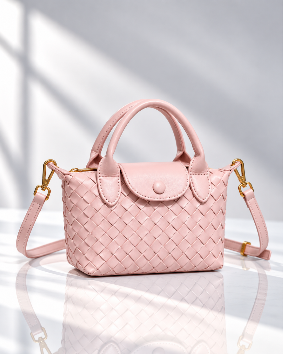 Women's pink woven handbag close-up — everyday — Marguerite Woven Crossbody Handbag — Oscar Blackwood