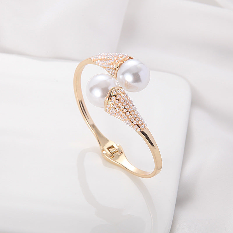 Women's jewelry styled look — versatile — Aura Pearl Bangle for every occasion — Oscar Blackwood